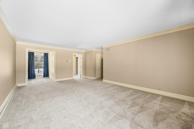 carpeted empty room featuring a baseboard radiator and crown molding