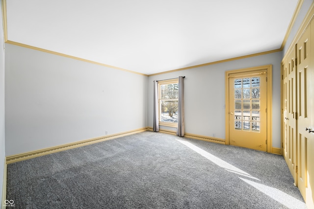 spare room featuring carpet floors, a baseboard radiator, and ornamental molding