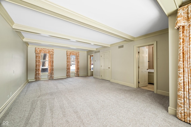 carpeted spare room with a baseboard heating unit, ornamental molding, and beam ceiling