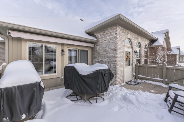 view of snow covered house