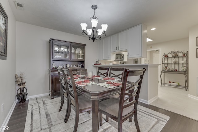 dining room featuring a notable chandelier