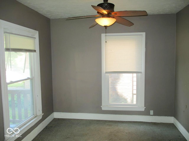 1138 W 33rd St, Indianapolis, IN 46208 - carpeted spare room featuring baseboards and a ceiling fan