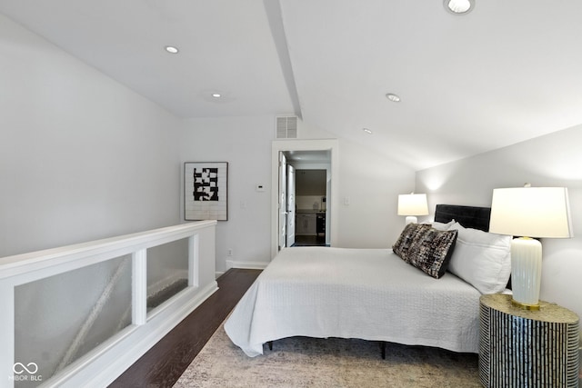 bedroom featuring dark hardwood / wood-style floors and vaulted ceiling