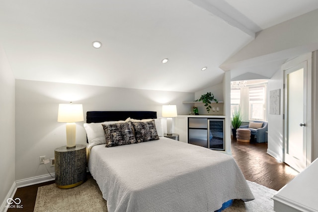 bedroom featuring vaulted ceiling with beams and wood-type flooring