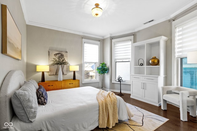 bedroom with crown molding, multiple windows, and dark wood-type flooring