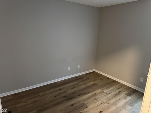 empty room with wood-type flooring