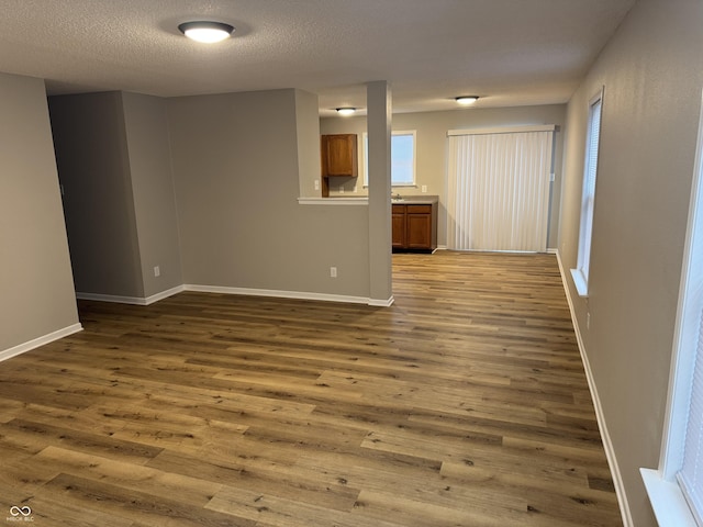 interior space with hardwood / wood-style floors and a textured ceiling