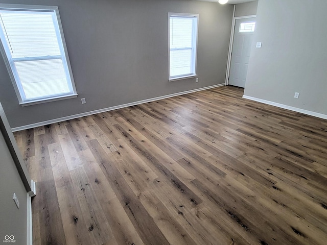 spare room with wood-type flooring