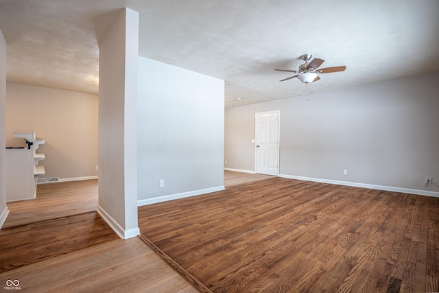 spare room featuring ceiling fan and hardwood / wood-style flooring