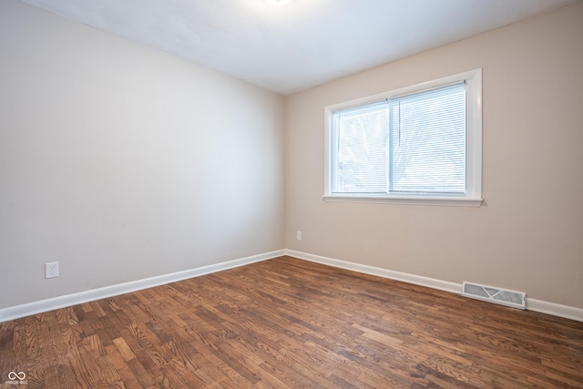 empty room featuring dark hardwood / wood-style floors