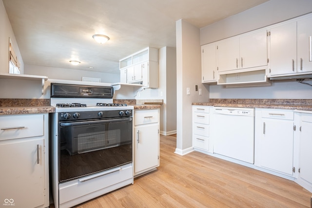 kitchen featuring white cabinetry, light hardwood / wood-style floors, and white appliances