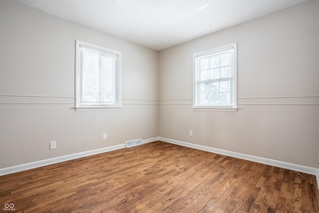 spare room featuring hardwood / wood-style flooring