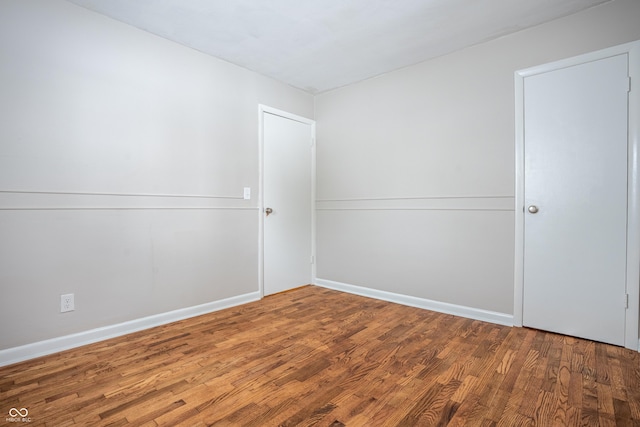 empty room featuring hardwood / wood-style flooring