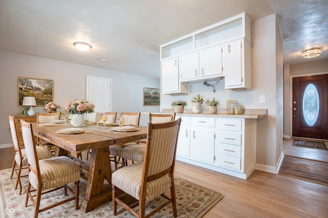 dining area with light hardwood / wood-style floors