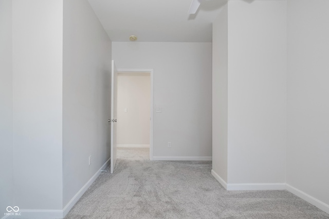 empty room featuring light carpet