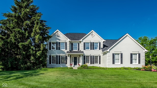 colonial home with a front yard