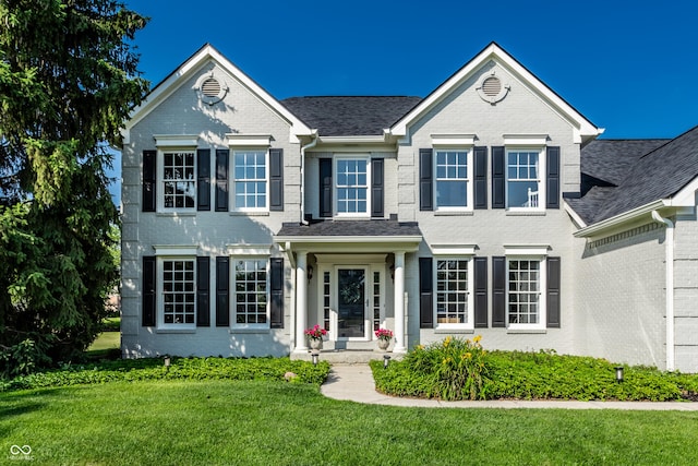 view of front of property with a front lawn