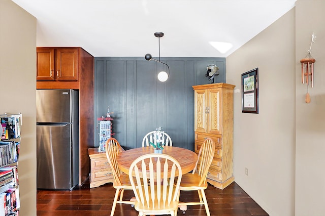 dining space featuring dark hardwood / wood-style flooring