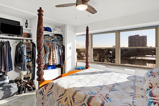 bedroom featuring ceiling fan and a closet