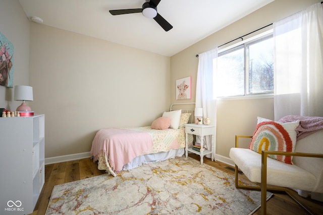 bedroom featuring hardwood / wood-style floors and ceiling fan