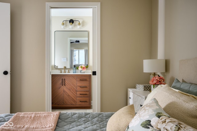 bedroom with sink and ensuite bath