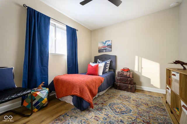 bedroom featuring ceiling fan and hardwood / wood-style floors