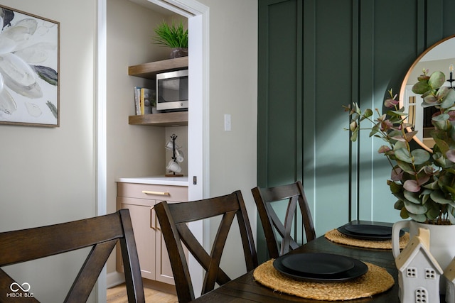 dining space with light hardwood / wood-style floors