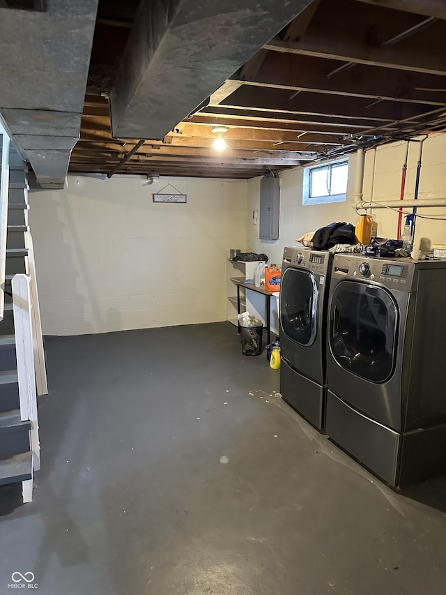 basement with electric panel and independent washer and dryer