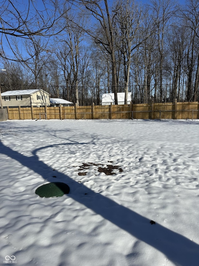 view of yard covered in snow