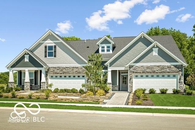 view of front of house featuring a front yard and a garage