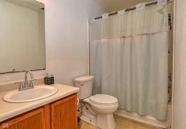 full bathroom featuring toilet, vanity, tile patterned floors, shower / bath combo, and a textured ceiling