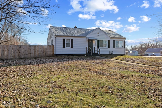 view of front of house featuring fence