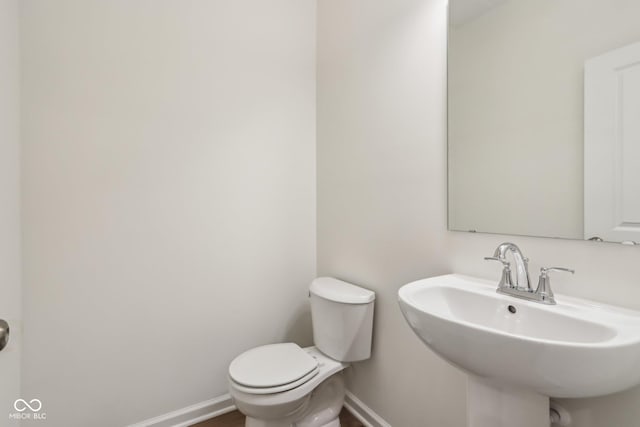 bathroom featuring sink and toilet