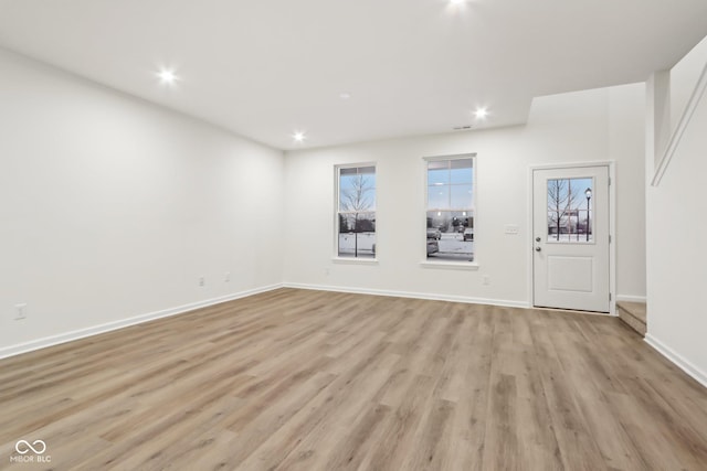 unfurnished room featuring light hardwood / wood-style flooring