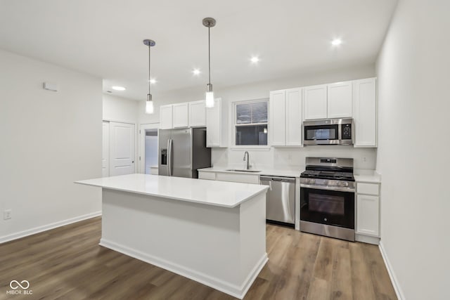 kitchen featuring sink, white cabinets, and appliances with stainless steel finishes