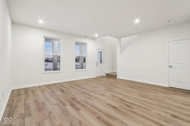 unfurnished room featuring light hardwood / wood-style flooring