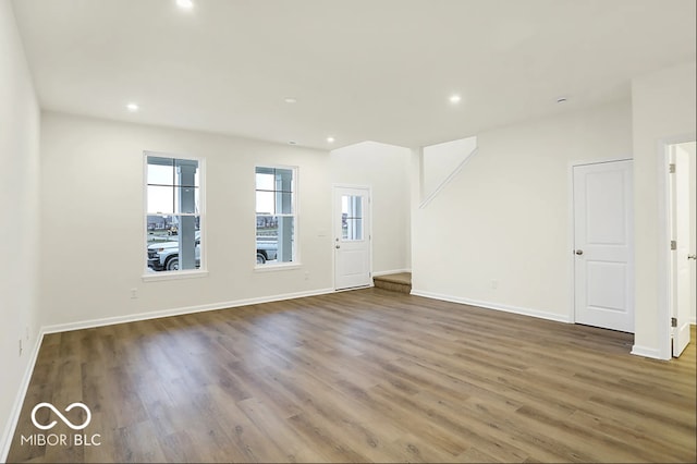3921 Wren Dr, Brownsburg, IN 46112 - unfurnished living room featuring wood finished floors and recessed lighting