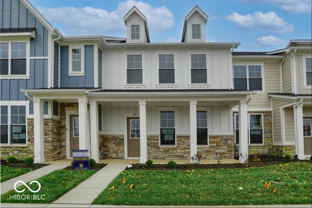 3921 Wren Dr, Brownsburg, IN 46112 - view of property with board and batten siding, stone siding, and covered porch