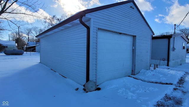 view of snow covered garage