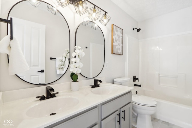 full bathroom featuring shower / tub combination, vanity, and toilet