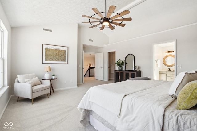 bedroom featuring high vaulted ceiling, ensuite bathroom, ceiling fan, a textured ceiling, and light colored carpet