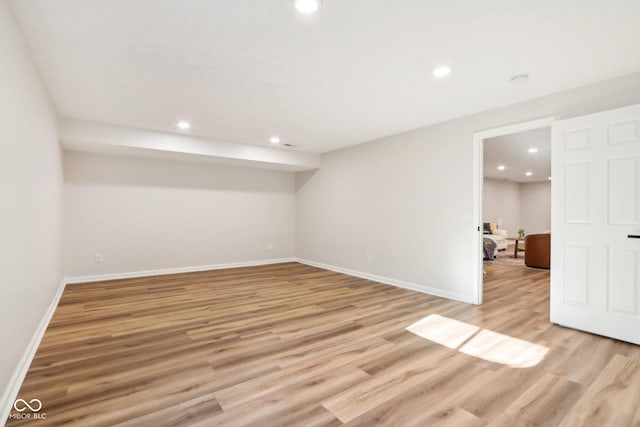 unfurnished room with light hardwood / wood-style flooring