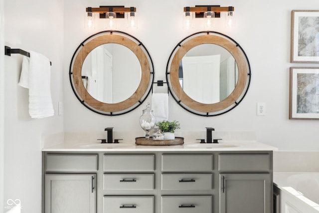 bathroom featuring a tub and vanity