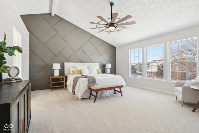 carpeted bedroom featuring vaulted ceiling with beams, ceiling fan, and a textured ceiling