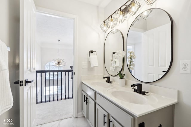 bathroom featuring vanity and an inviting chandelier