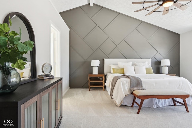 bedroom featuring vaulted ceiling with beams, ceiling fan, and light carpet