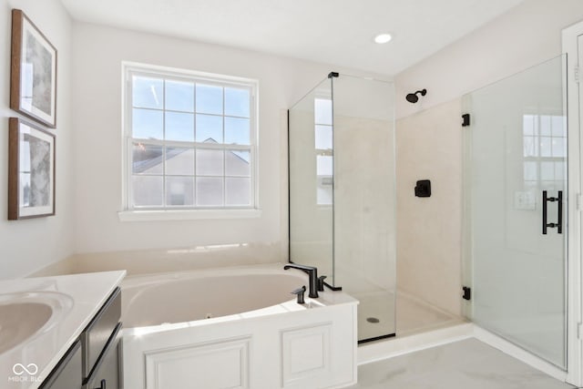 bathroom featuring vanity and plus walk in shower