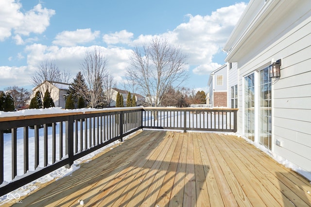 view of snow covered deck