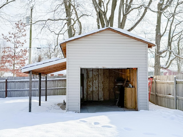 view of snow covered garage