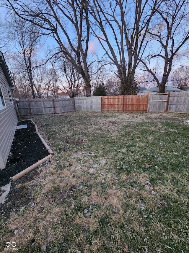 view of yard with a fenced backyard